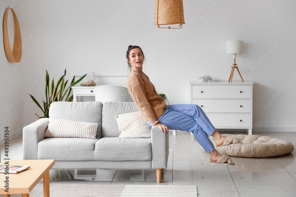 Pretty young woman relaxing at home