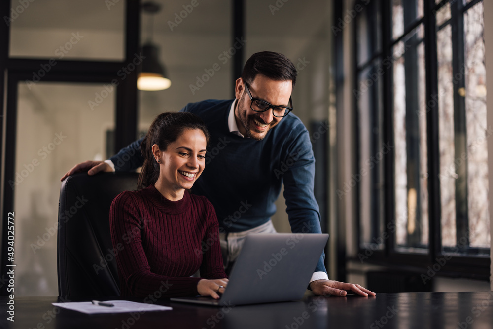 Businesswoman, working at the office, having help from a boss.