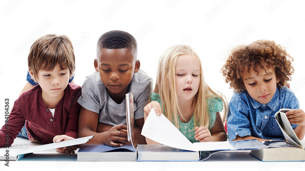 Children who read become adults who think. Studio shot of a group of young friends lying on the floo