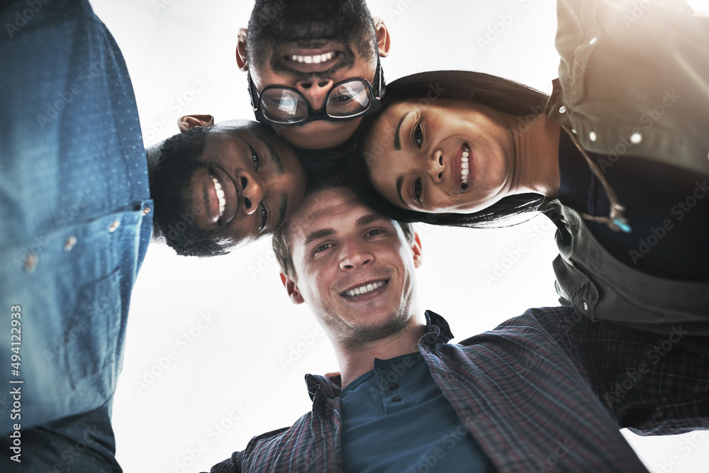 Were looking down on everyone who doubted us. Low angle portrait of a group of young business people