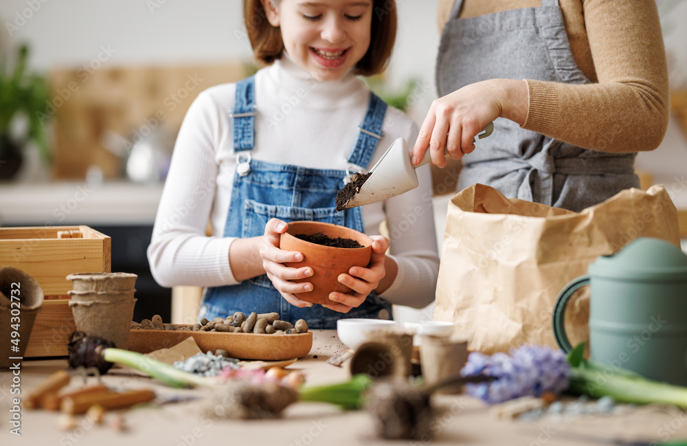 Mom and kid doing home gardening together