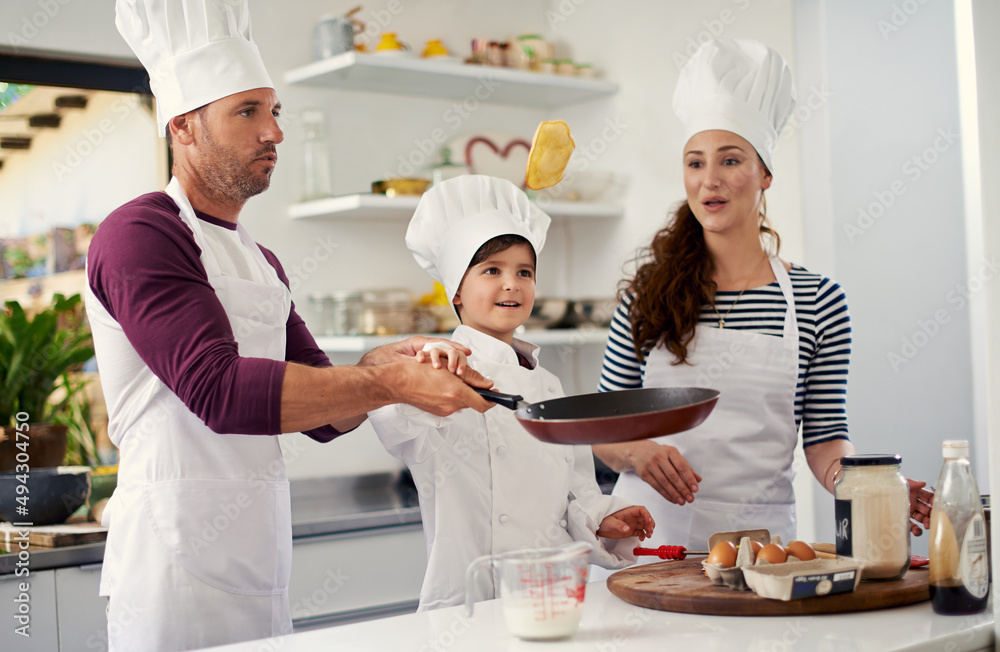 Count the memories not the calories. Shot of a family of three baking together in the kitchen.