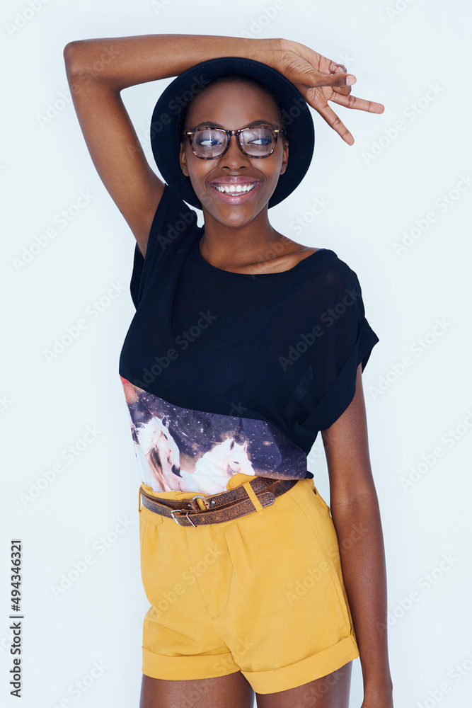 Fun with facial expressions. A young model posing against white.