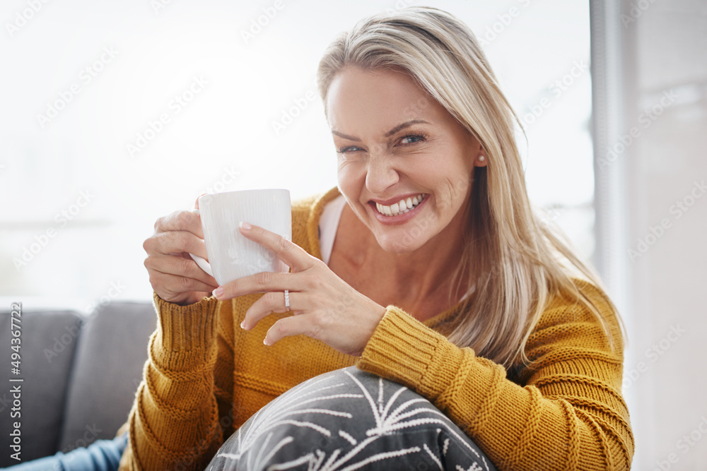 For a relaxing time at home just add coffee. Portrait of an attractive mature woman enjoying a bever