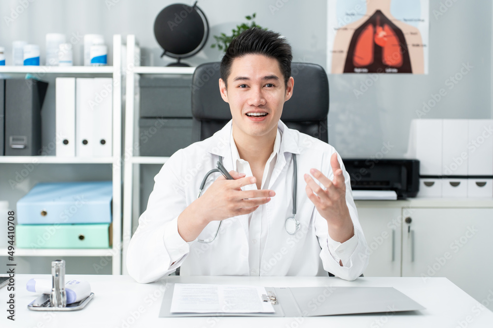 Asian male medical doctor talking virtual online with patient at home.