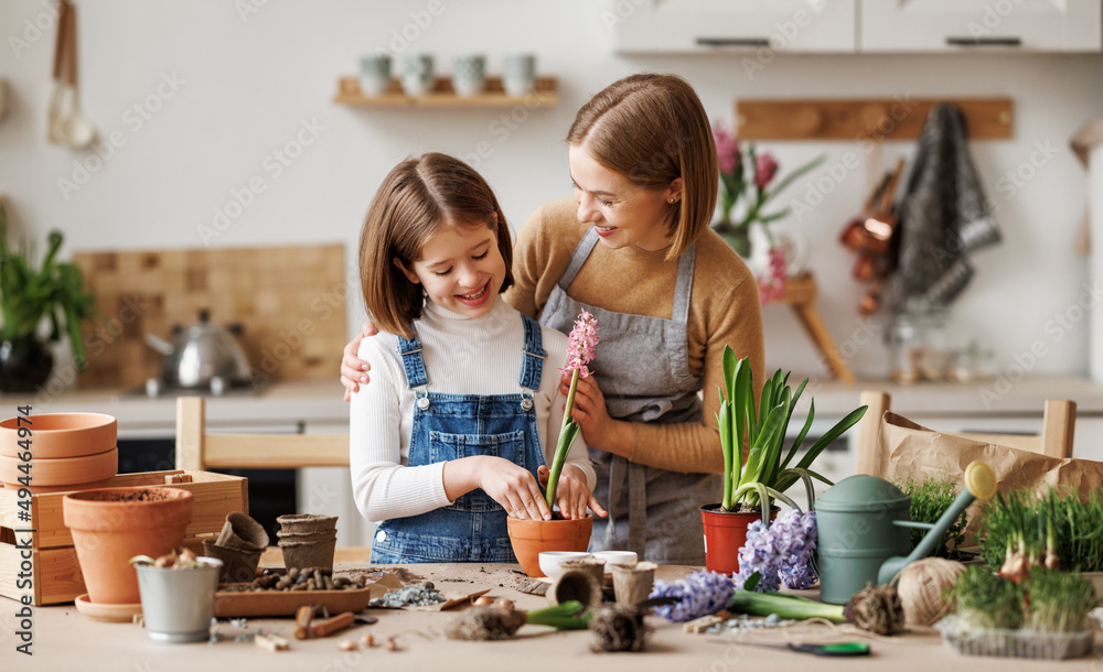 Mom and kid doing home gardening together