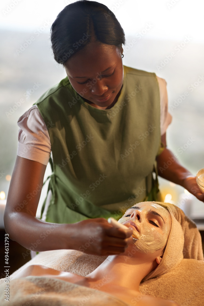 Taking care of your beauty. Shot of a young woman receiving a beauty treatment in a spa.