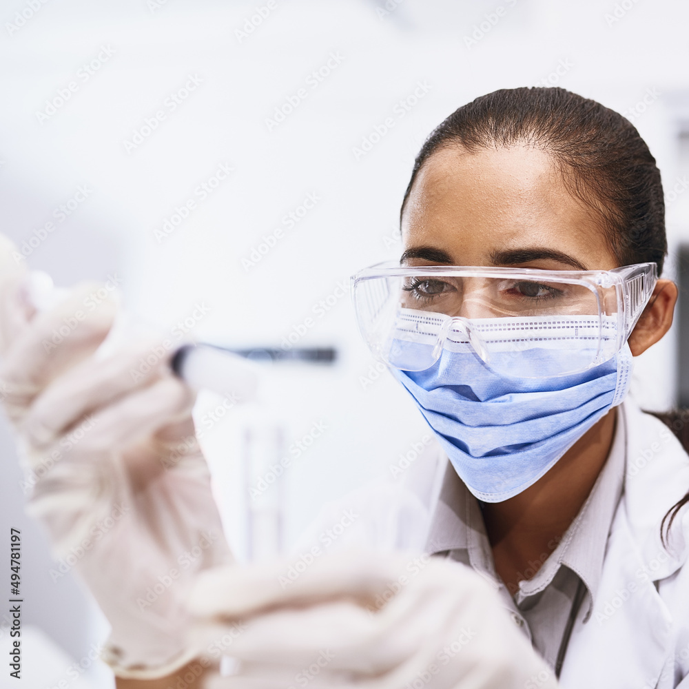 Shell find all the answers through science. Shot of a young scientist working in a lab.