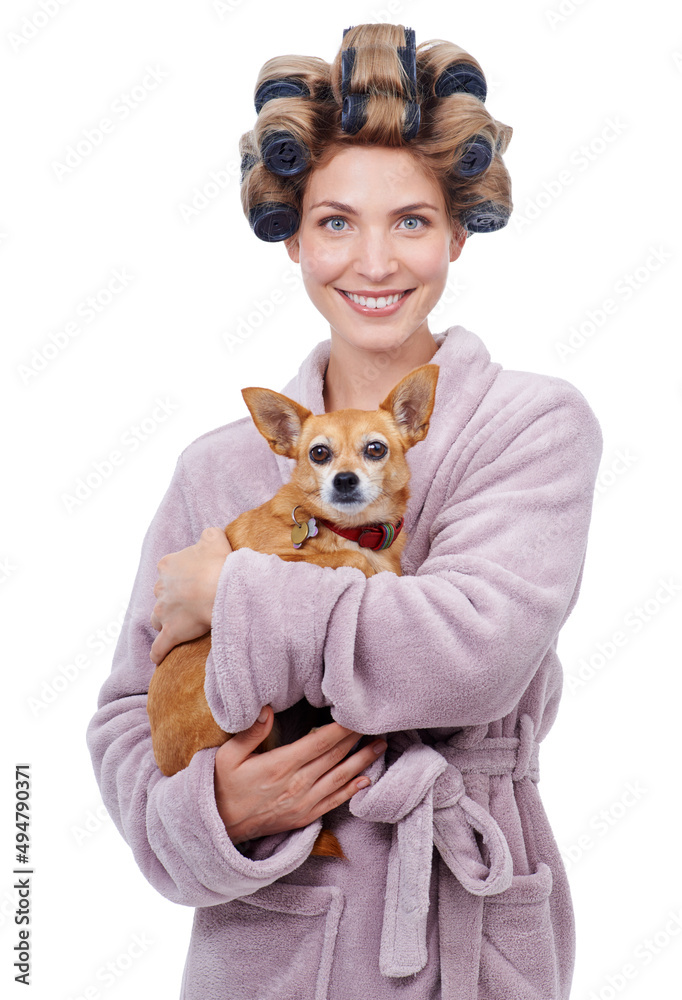 Fresh out the shower. Portrait of a happy young woman holding her dog while standing in a bathrobe.