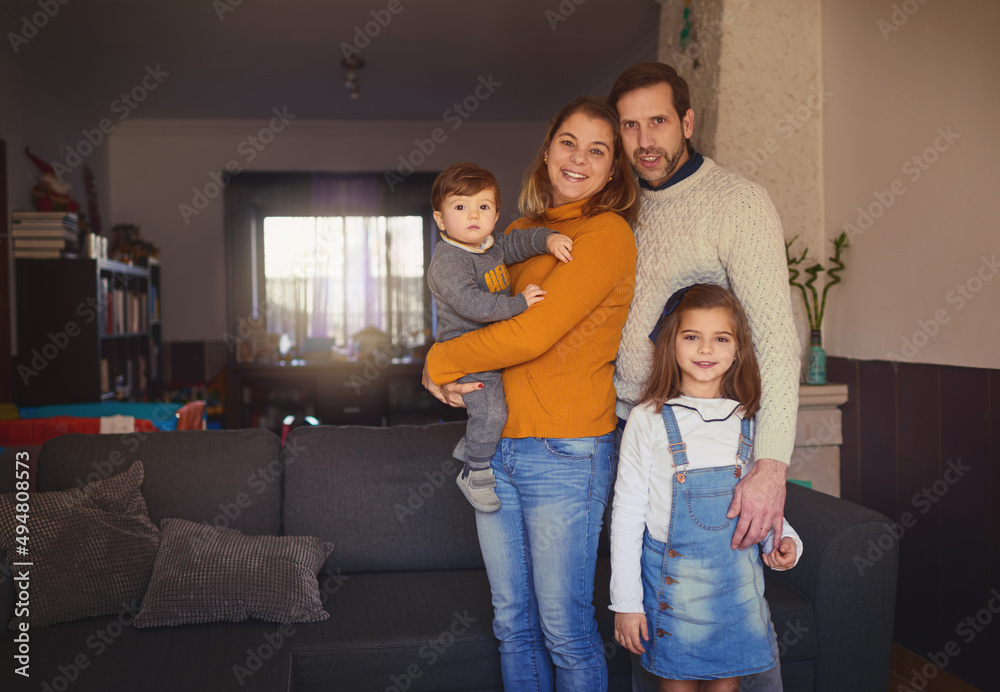 Family comes before everything else. Cropped portrait of an affectionate young family of four standi