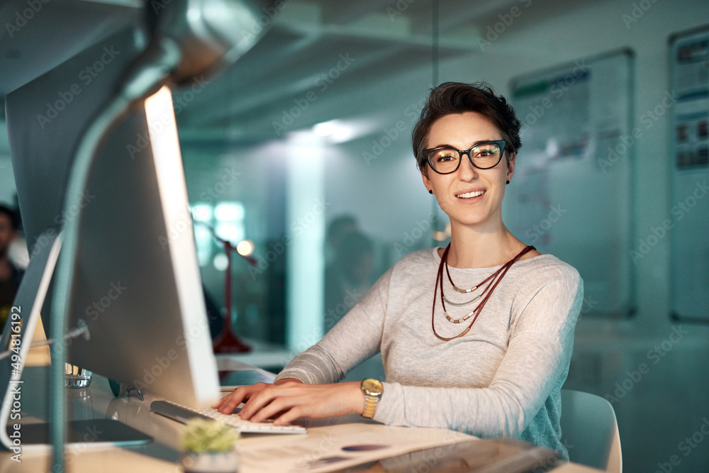 Hard work produces great workers. Shot of a young businesswoman working late at the office.