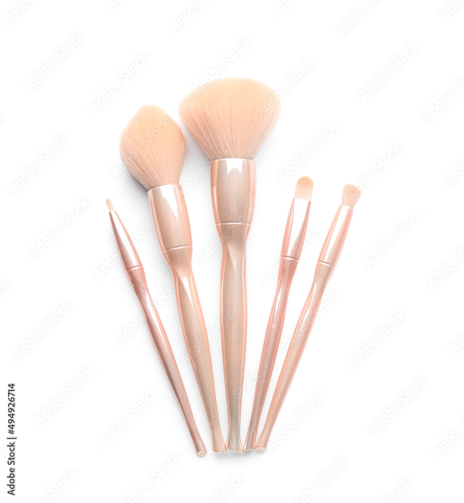 Set of makeup brushes isolated on white, top view