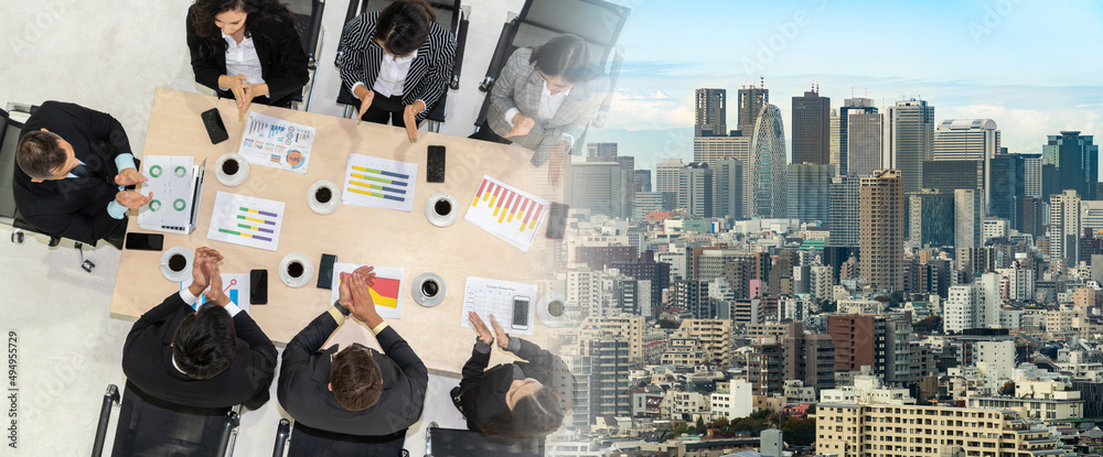 Successful business people celebrate together with joy at office table shot from top view . Young bu