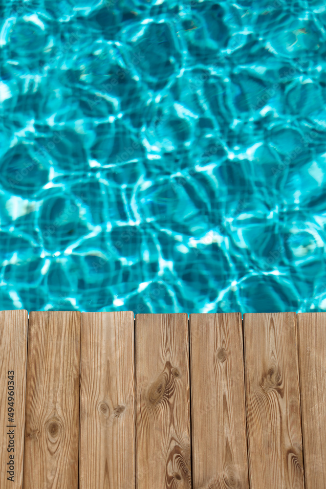 Wooden background against blurred water