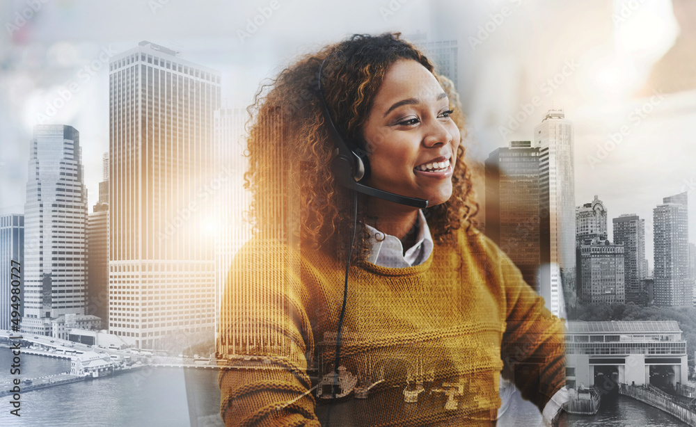 Dont forget to smile. Shot of a female agent working in a call centre.