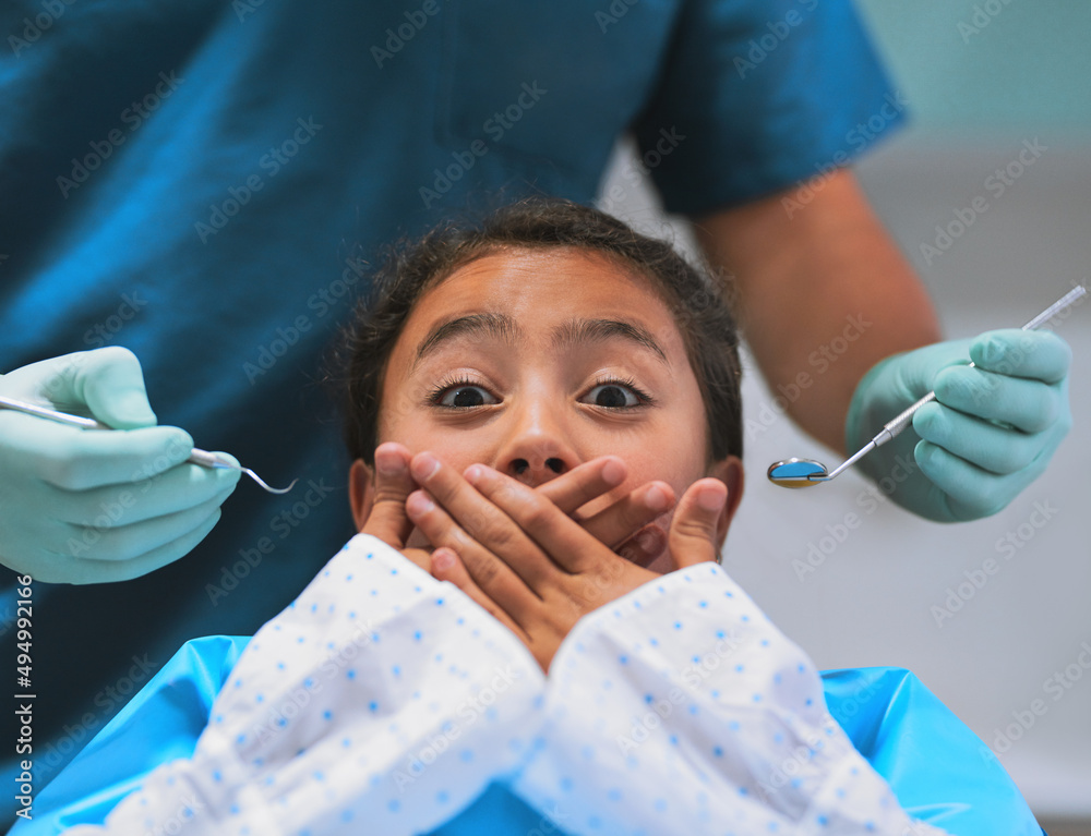 I dont think Im ready for this. Shot of a frightened little girl lying down on a dentist chair and h