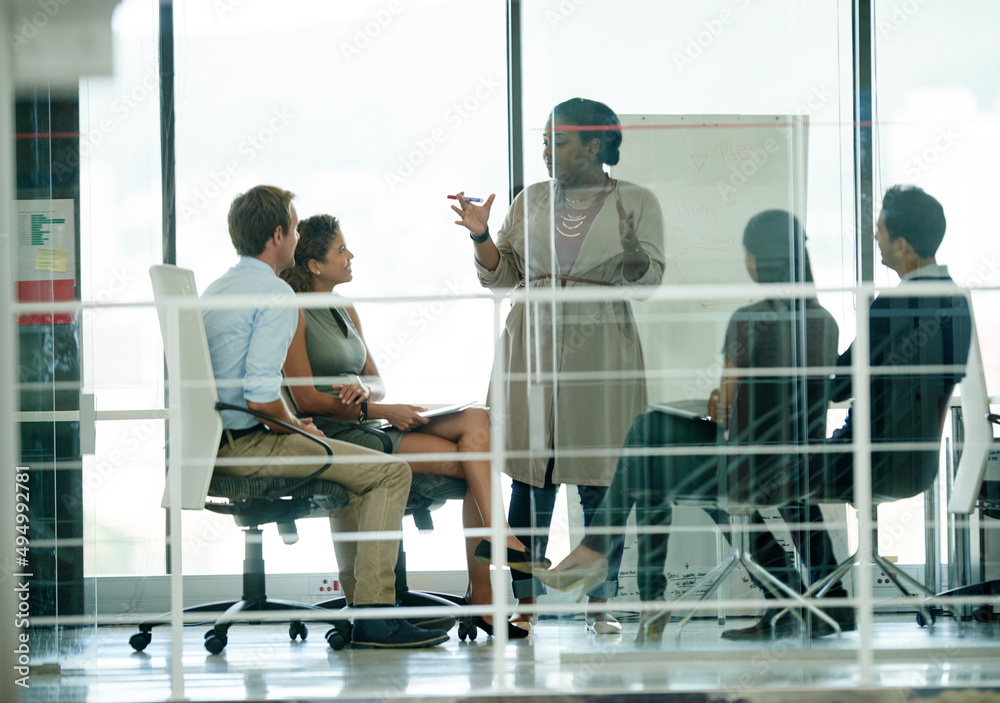 Im expecting our market share to expand. Shot of a group of colleagues brainstorming in an office.