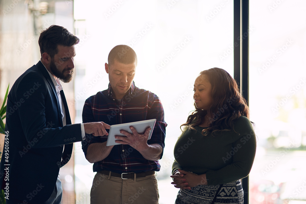 We can make a few changes here. Shot of a focused group of businesspeople having a discussion while 