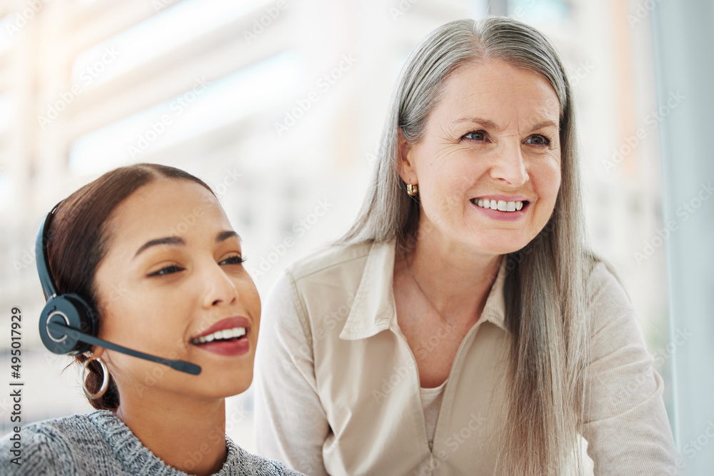 Its been a pleasure being of service. Shot of an attractive young call centre agent sitting in the o