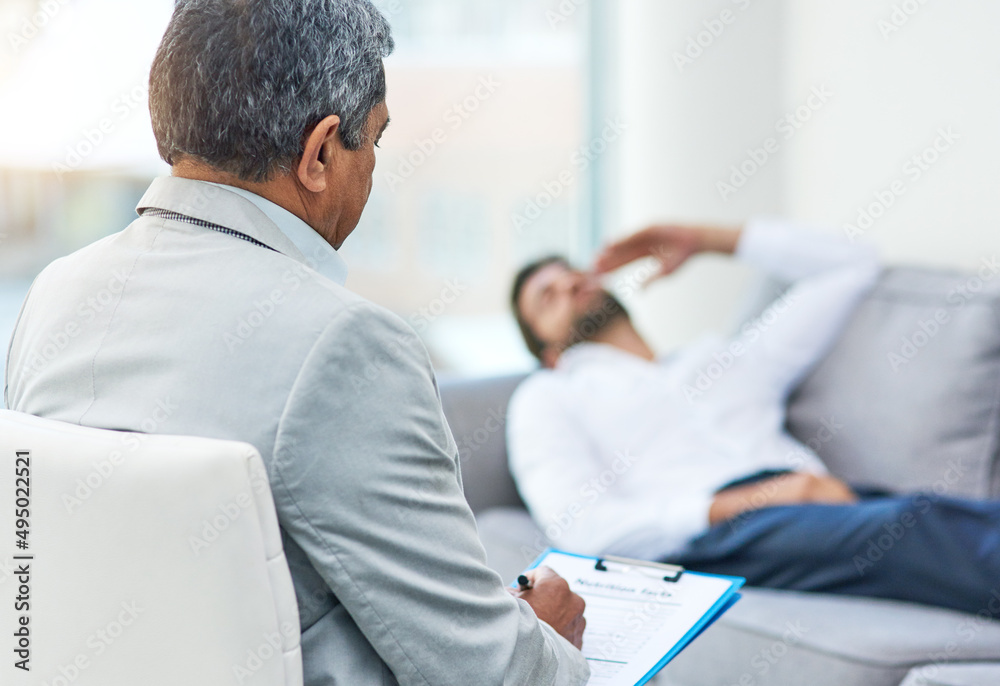 Relax and start from the beginning. Shot of an stressed out young man having a discussion with his d