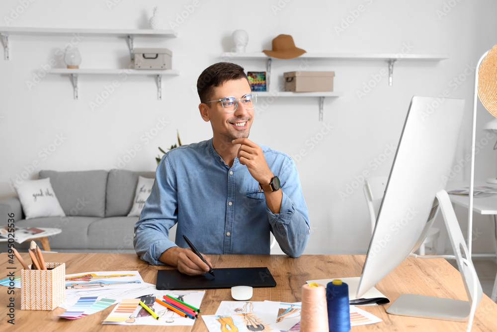 Male fashion designer working in studio