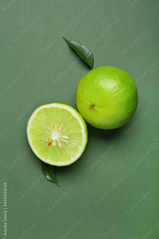 Ripe bergamot fruits on green background