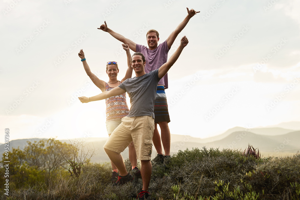 Hike more, worry less. Portrait of three happy friends posing together during a hike in the mountain