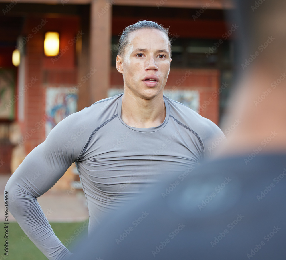 Working out outside in the fresh air is amazing. Shot of a young man with his workout partner.