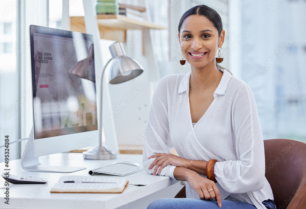 Where others fail youll prevail in time. Portrait of a young businesswoman sitting at a desk in a mo