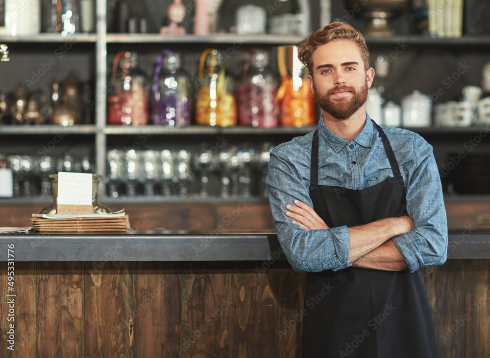 The barista who brews it best. Portrait of a young barista working in a cafe.