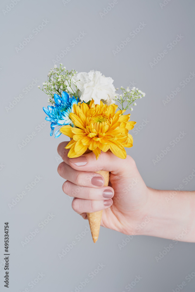 Unlike flowers, you can have cones any season. Cropped shot of an unrecognizable woman holding a con