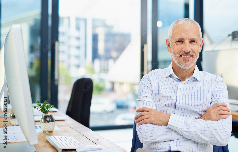 Success is the product of confidence. Cropped portrait of a mature businessman sitting with his arms