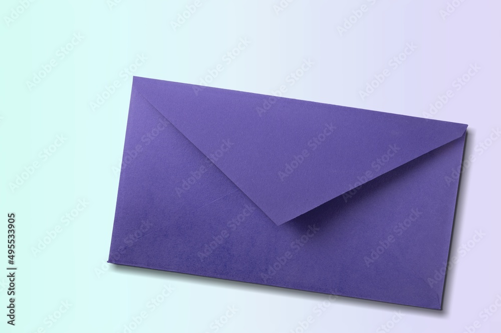 Navy envelope on desk background. Kraft paper with subtle fibers.