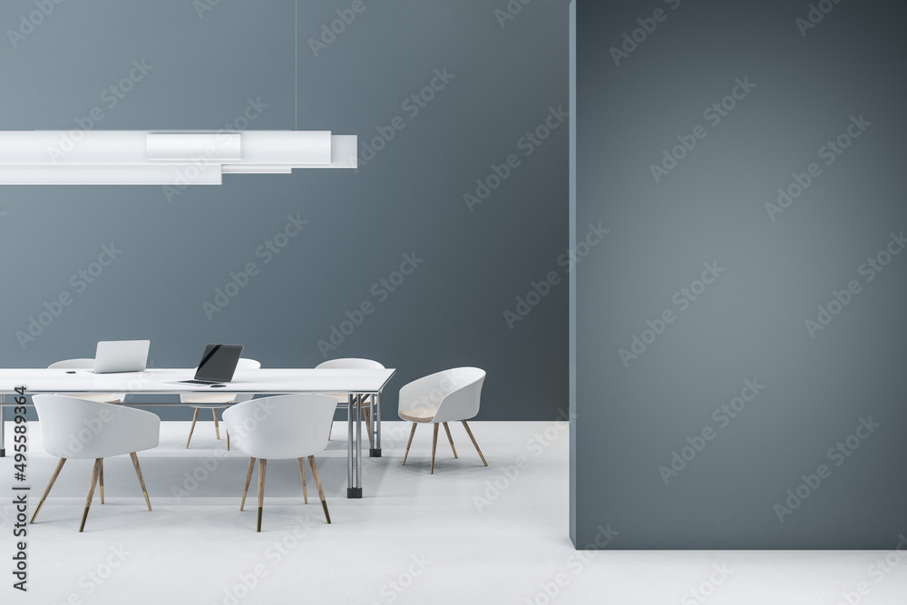 Modern concrete meeting room interior with empty mock up place on wall, furniture, ceiling lamp and 