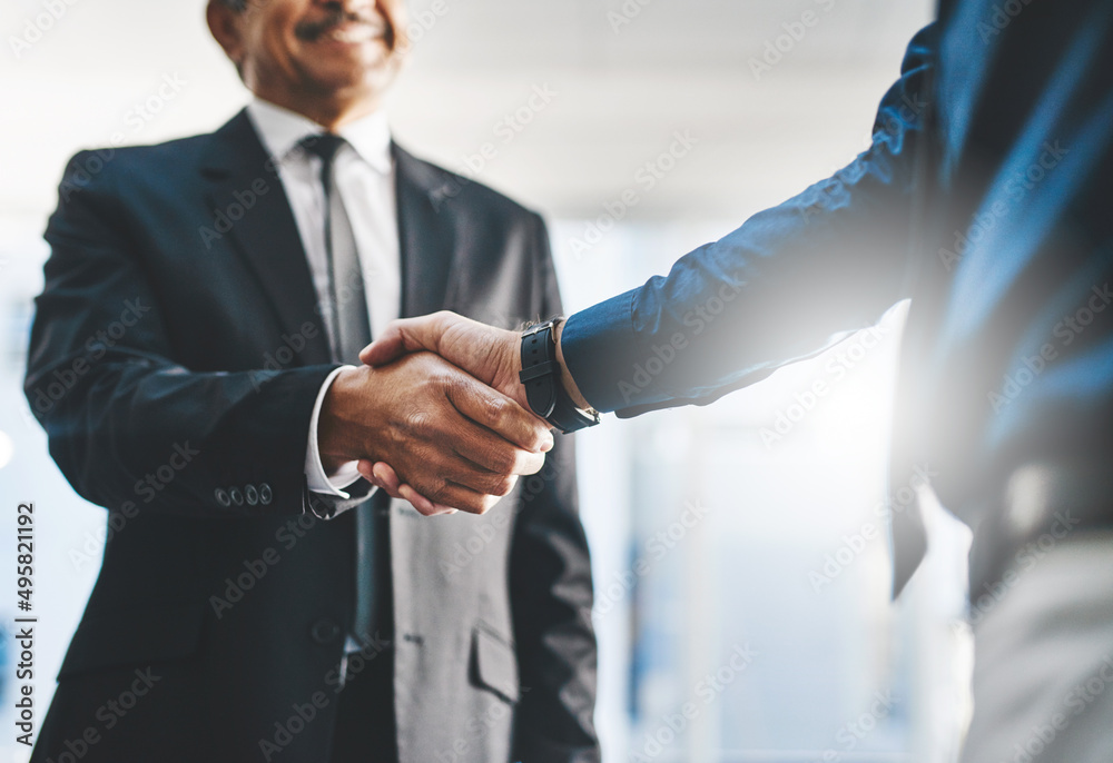 Lets build a better business together. Shot of two unrecognisable businesspeople shaking hands in an