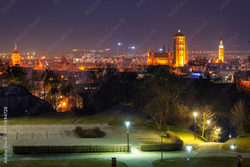 Cityscape of Gdansk with historic architecture at night, Poland.