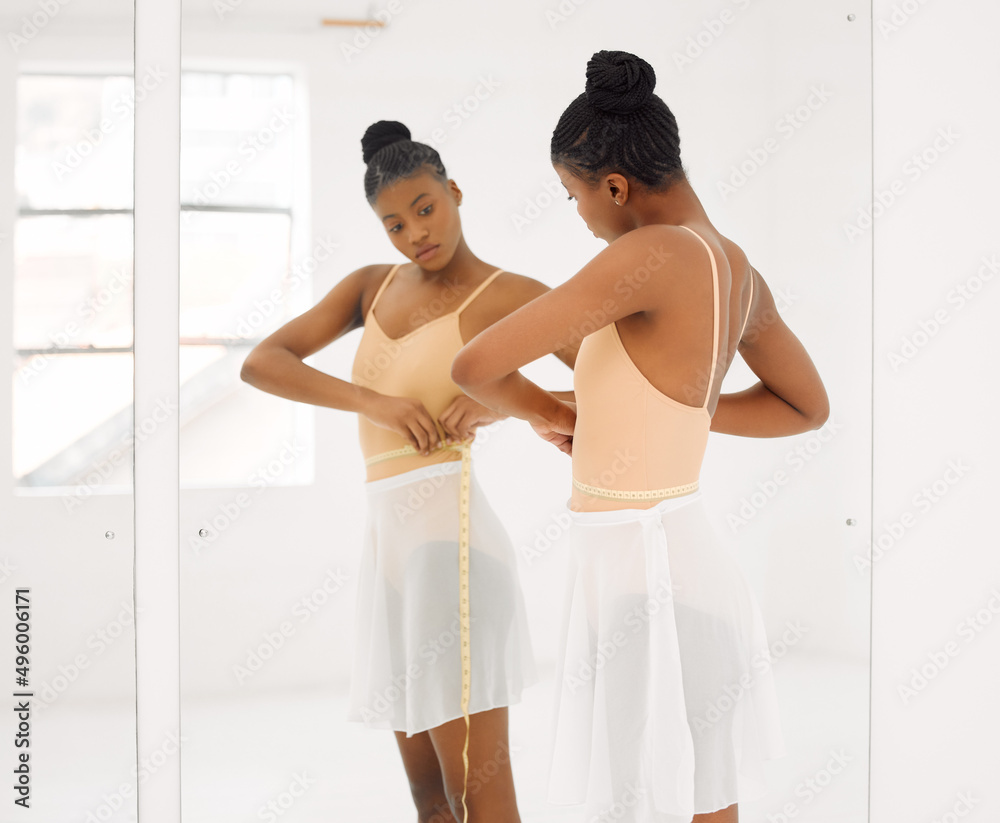 Dont let insecure thoughts ruin something amazing. Shot of a beautiful young ballet dancer measuring