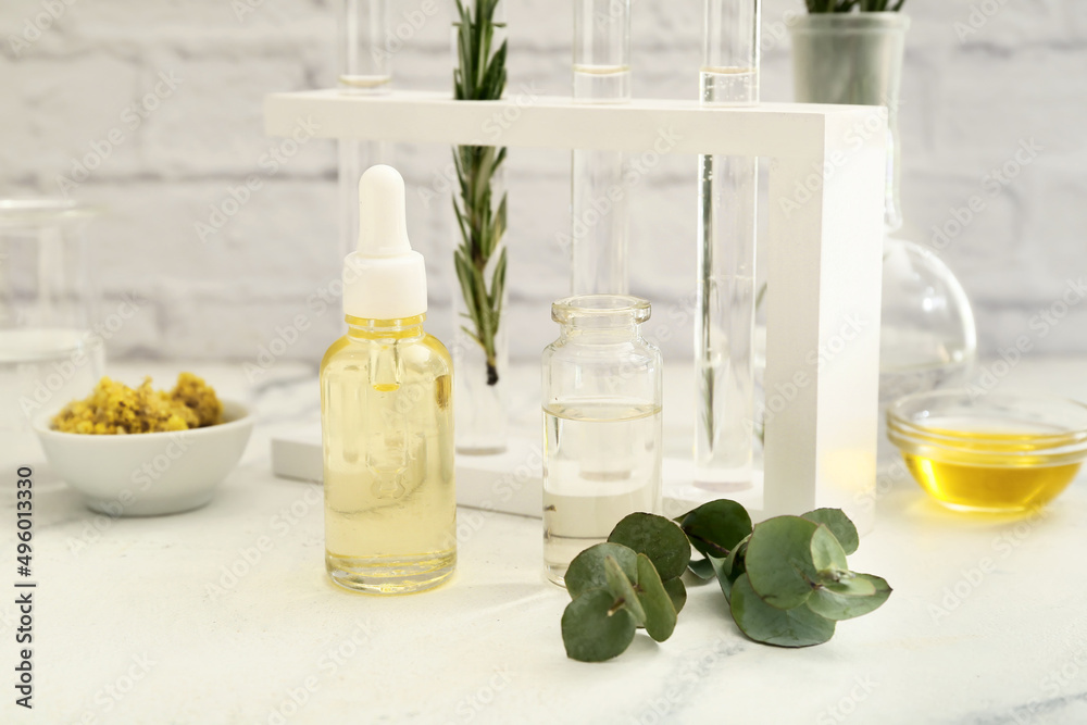 Bottles of natural essential oil in laboratory