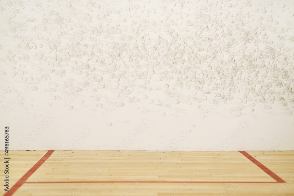 A haven for squash enthusiasts. Shot of an empty squash court.