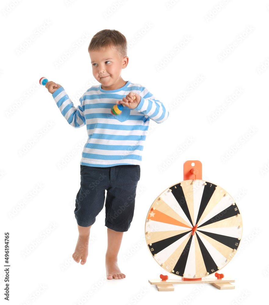 Cute little boy playing with wooden toys on white background