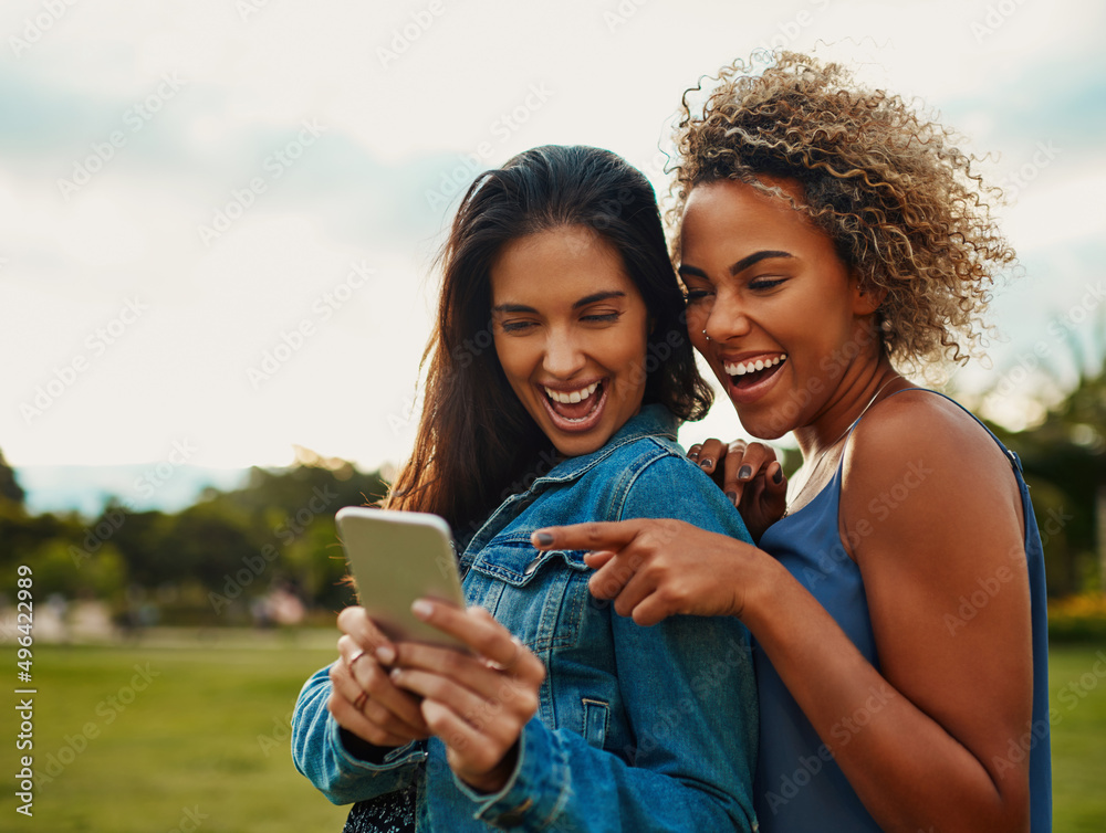 This is that app I was talking about. Cropped shot of two attractive young girlfriends using a smart