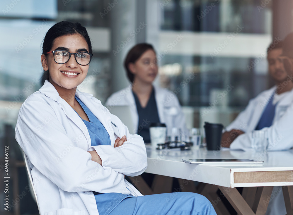 Its always great to catch up with coworkers. Shot of a female doctor sitting down to take a break fr