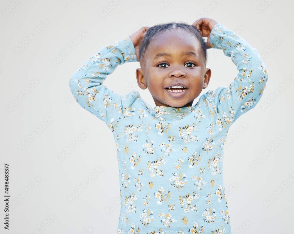 Someone just broke the cute meter. Shot of an adorable little girl standing against a white backgrou