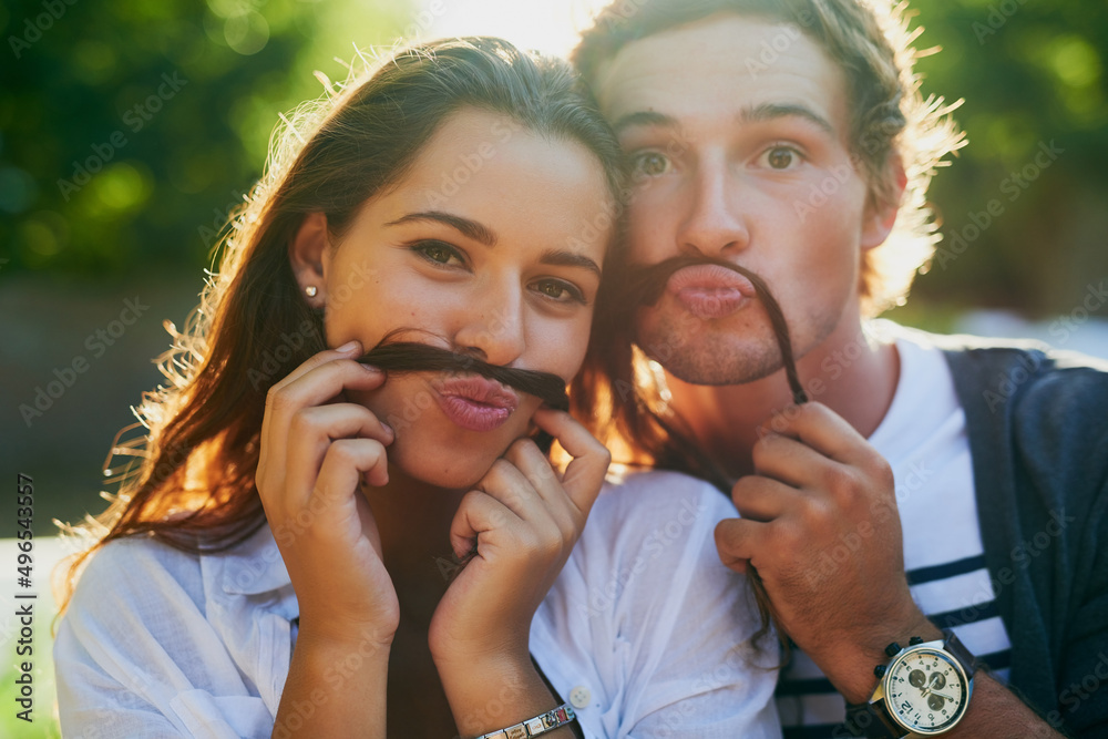 We moustache you if you notice anything different about us. Portrait of a young couple enjoying a si