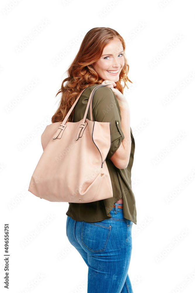 Check out my new designer bag. Shot of a young woman posing against a white background.