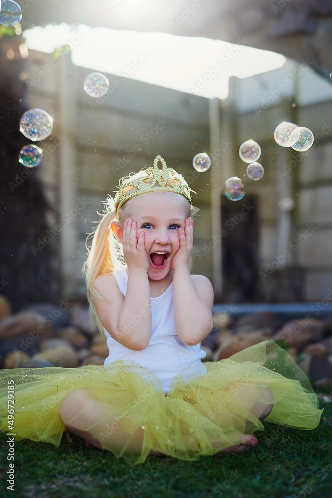 Her imagination takes her to exciting places. Full length shot of an adorable little girl looking ex