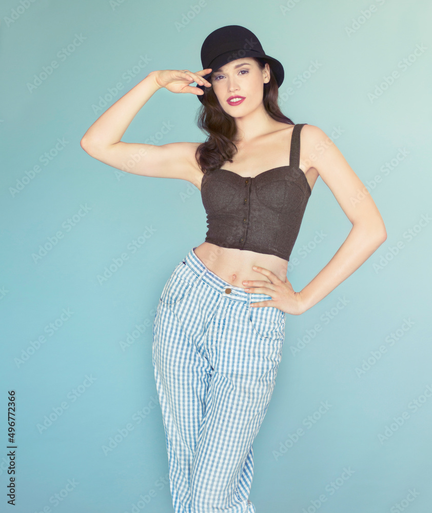 Youve caught her eye.... Studio portrait of an attractive and stylish young woman wearing an old-fas