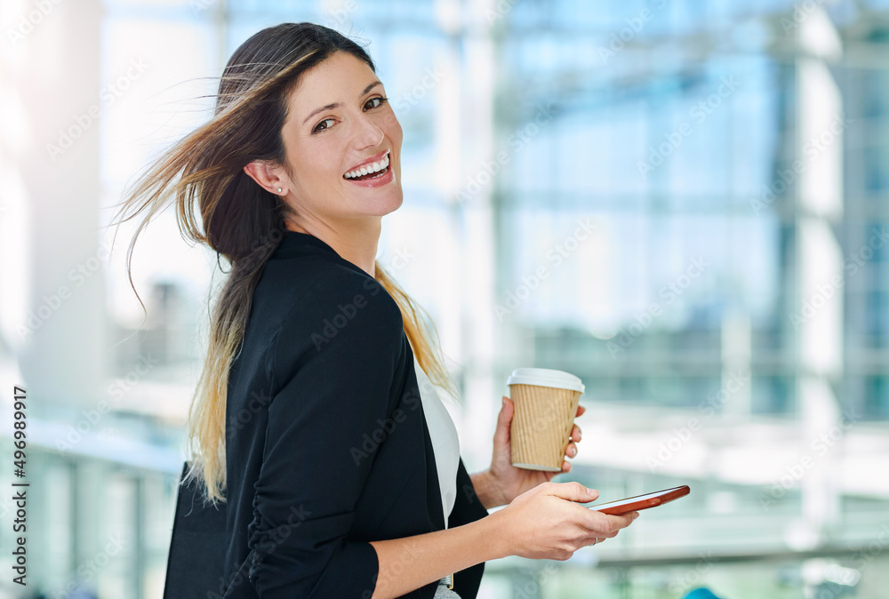 Always start your day with a smile. Cropped portrait of an attractive young businesswoman smiling wh