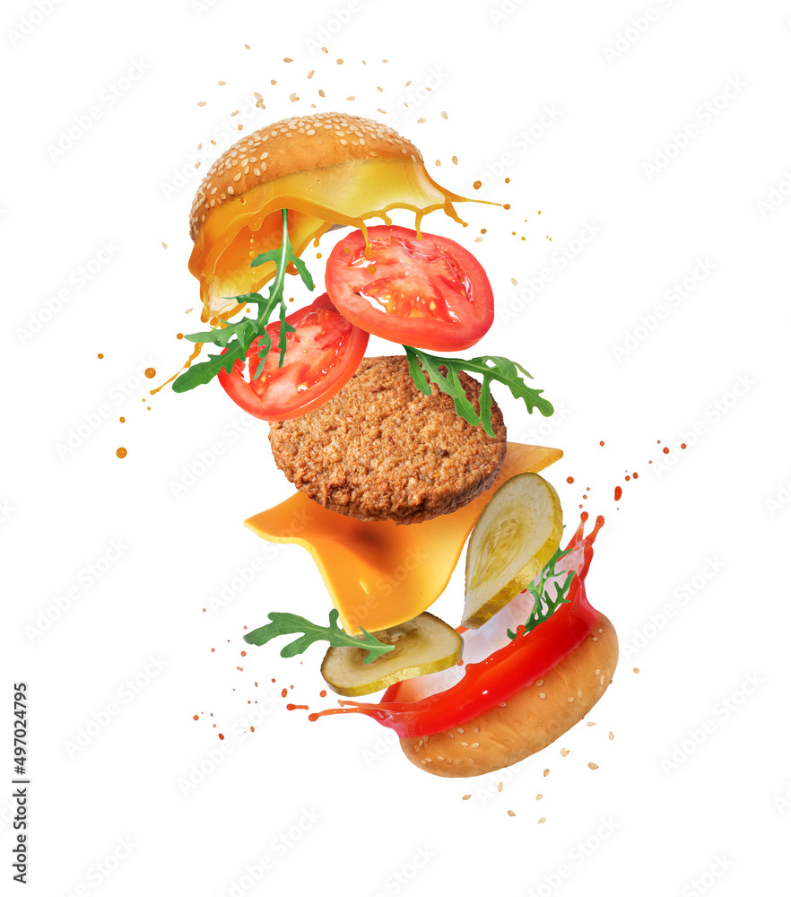 Food ingredients for a traditional burger in the air isolated on a white background