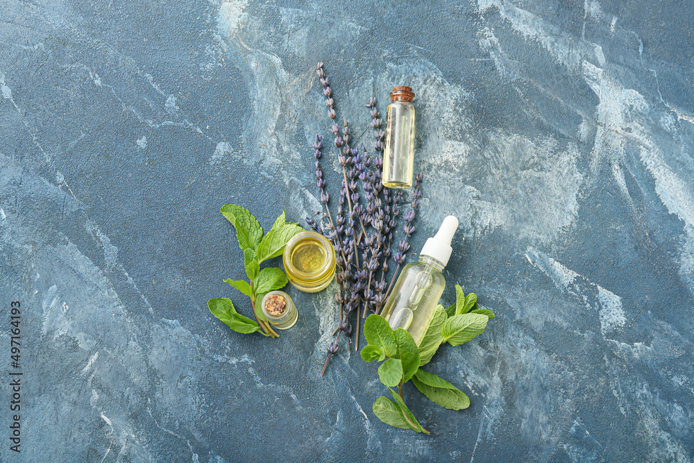 Natural essential oils on color background